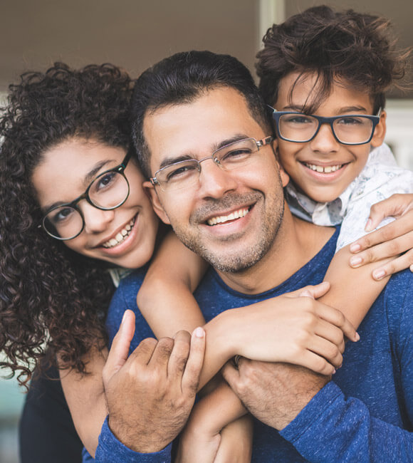 family of three smiling together
